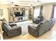 Spacious living room featuring tile floors, ceiling fans, and a neutral color scheme perfect for relaxation at 213 S Lake Pleasant Rd, Apopka, FL 32703