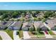 An overhead view of several single-story homes with well-maintained yards and dark roofs at 2312 Rose Blvd, Winter Haven, FL 33881
