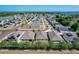 This aerial showcases houses in a community with solar panels and well-maintained lawns at 2312 Rose Blvd, Winter Haven, FL 33881