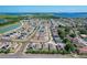 An aerial view of the community with houses and a large lake in the distance at 2312 Rose Blvd, Winter Haven, FL 33881
