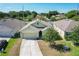 Overhead view of a single-story home with green lawn, dark roof, and a two-car garage at 2312 Rose Blvd, Winter Haven, FL 33881