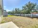 A spacious backyard featuring a white fence and ample lawn at 2312 Rose Blvd, Winter Haven, FL 33881