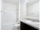 Bright bathroom featuring a tub/shower combo and a vanity with a sink and countertop at 2312 Rose Blvd, Winter Haven, FL 33881