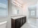 Bathroom with double sink vanity and bright natural light at 2312 Rose Blvd, Winter Haven, FL 33881