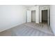 Bedroom featuring neutral carpet, access to a closet and bathroom at 2312 Rose Blvd, Winter Haven, FL 33881