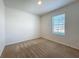 Cozy bedroom featuring neutral carpet and a bright window at 2312 Rose Blvd, Winter Haven, FL 33881