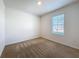 Inviting bedroom features neutral carpet and a bright window at 2312 Rose Blvd, Winter Haven, FL 33881