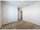 Bright bedroom with neutral walls and carpet, featuring a closet and open doorway at 2312 Rose Blvd, Winter Haven, FL 33881