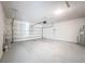 Spacious two-car garage with white walls and concrete floors at 2312 Rose Blvd, Winter Haven, FL 33881