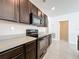 Stylish kitchen features stainless steel appliances, dark cabinets and light countertops at 2312 Rose Blvd, Winter Haven, FL 33881