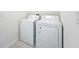 Laundry room featuring white washer and dryer units on a tiled floor at 2312 Rose Blvd, Winter Haven, FL 33881