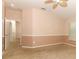Bedroom with a neutral color scheme, carpeted flooring, and multiple doors leading to other rooms at 2530 San Jacinto Cir # 2530, Sanford, FL 32771