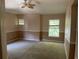 Neutral bedroom with carpet, ceiling fan, and bright natural light from windows at 2530 San Jacinto Cir # 2530, Sanford, FL 32771