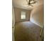 Cozy bedroom featuring a ceiling fan, large window, and plush carpeting at 2530 San Jacinto Cir # 2530, Sanford, FL 32771