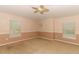 Bedroom boasting neutral colors, a ceiling fan, and three windows with blinds for ample natural light at 2530 San Jacinto Cir # 2530, Sanford, FL 32771