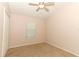 Bright bedroom with carpet flooring, ceiling fan, and a window letting in natural light at 2530 San Jacinto Cir # 2530, Sanford, FL 32771