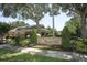 Exterior view of a community clubhouse and landscaped sign for Flagship Park at 2530 San Jacinto Cir # 2530, Sanford, FL 32771