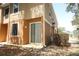 Townhome exterior with sliding glass door, back patio, and neutral color scheme at 2530 San Jacinto Cir # 2530, Sanford, FL 32771