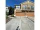 Two-story townhome with brown garages and balconies on the second floor at 2530 San Jacinto Cir # 2530, Sanford, FL 32771