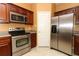Kitchen with stainless steel appliances, oven, and stainless steel refrigerator at 2530 San Jacinto Cir # 2530, Sanford, FL 32771