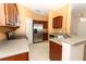 Modern kitchen with stainless steel appliances and wooden cabinets at 2530 San Jacinto Cir # 2530, Sanford, FL 32771