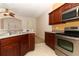 Kitchen with stainless steel appliances, and dark wood cabinetry at 2530 San Jacinto Cir # 2530, Sanford, FL 32771