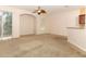 Living room with sliding glass doors, ceiling fan and neutral carpet at 2530 San Jacinto Cir # 2530, Sanford, FL 32771