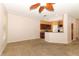 Open concept living room and kitchen with ceiling fan and neutral carpet at 2530 San Jacinto Cir # 2530, Sanford, FL 32771