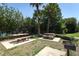 Community picnic area with picnic benches, trees, and a BBQ grill at 2530 San Jacinto Cir # 2530, Sanford, FL 32771