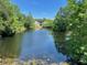 Scenic pond surrounded by mature trees offering a tranquil community view at 2530 San Jacinto Cir # 2530, Sanford, FL 32771