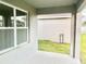 Covered patio showing exterior wall and green lawn at 2637 Rowan St, Tavares, FL 32778