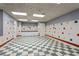 Bright activity room with tiled floors, multiple sinks, and well-lit space at 2704 Gorst Rd, Winter Garden, FL 34787