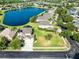 Spacious corner lot, aerial view of a lovely home with a lake view, boasting curb appeal at 2704 Gorst Rd, Winter Garden, FL 34787