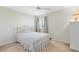 Bedroom with carpet, neutral walls, white ceiling fan, and shuttered window at 2704 Gorst Rd, Winter Garden, FL 34787
