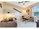 Bedroom with neutral color scheme, stylish light fixtures, and a wooden propeller decor at 2704 Gorst Rd, Winter Garden, FL 34787