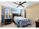Bedroom featuring an airplane-themed accent wall and shutters on the windows at 2704 Gorst Rd, Winter Garden, FL 34787