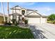 Charming two-story home with a three-car garage and well-maintained landscaping at 2704 Gorst Rd, Winter Garden, FL 34787