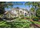 Beautiful two-story home with lush landscaping and a paver walkway at 2704 Gorst Rd, Winter Garden, FL 34787