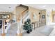 Open foyer with staircase, tile flooring, neutral paint, and decorative accents at 2704 Gorst Rd, Winter Garden, FL 34787