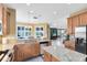 Spacious kitchen featuring granite countertops, stainless steel appliances, and plenty of cabinet space at 2704 Gorst Rd, Winter Garden, FL 34787
