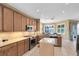 Well-equipped kitchen featuring stainless steel appliances, granite countertops, and a convenient center island at 2704 Gorst Rd, Winter Garden, FL 34787