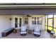 Relaxing covered patio with comfortable seating, perfect for enjoying the outdoors at 2704 Gorst Rd, Winter Garden, FL 34787