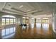 Spacious recreation room with hardwood floors, large windows, and ample natural light at 2704 Gorst Rd, Winter Garden, FL 34787