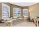 Cozy sitting area featuring a bay window with built-in bench seating and plush pillows at 2704 Gorst Rd, Winter Garden, FL 34787