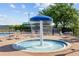 Community splash pad with a mushroom water feature surrounded by lounge chairs at 2704 Gorst Rd, Winter Garden, FL 34787