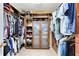 Spacious walk-in closet with custom wood shelving and ample storage space at 2704 Gorst Rd, Winter Garden, FL 34787