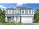 Charming two-story home featuring a light blue exterior, white trim, and a welcoming two-car garage at 30334 Emerald Forest Dr, Mount Dora, FL 32757