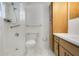Clean, bright bathroom features a step-in shower with hand-held shower head and a marble floor at 36208 Micro Racetrack Rd, Fruitland Park, FL 34731