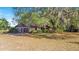 Charming home with mature trees provides a picturesque and shaded landscape at 36208 Micro Racetrack Rd, Fruitland Park, FL 34731