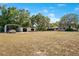 The property features a large yard with a house and a detached garage/carport structure at 36208 Micro Racetrack Rd, Fruitland Park, FL 34731